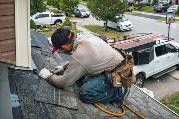 Professional Roof Replacement technician working in Monroeville, IN